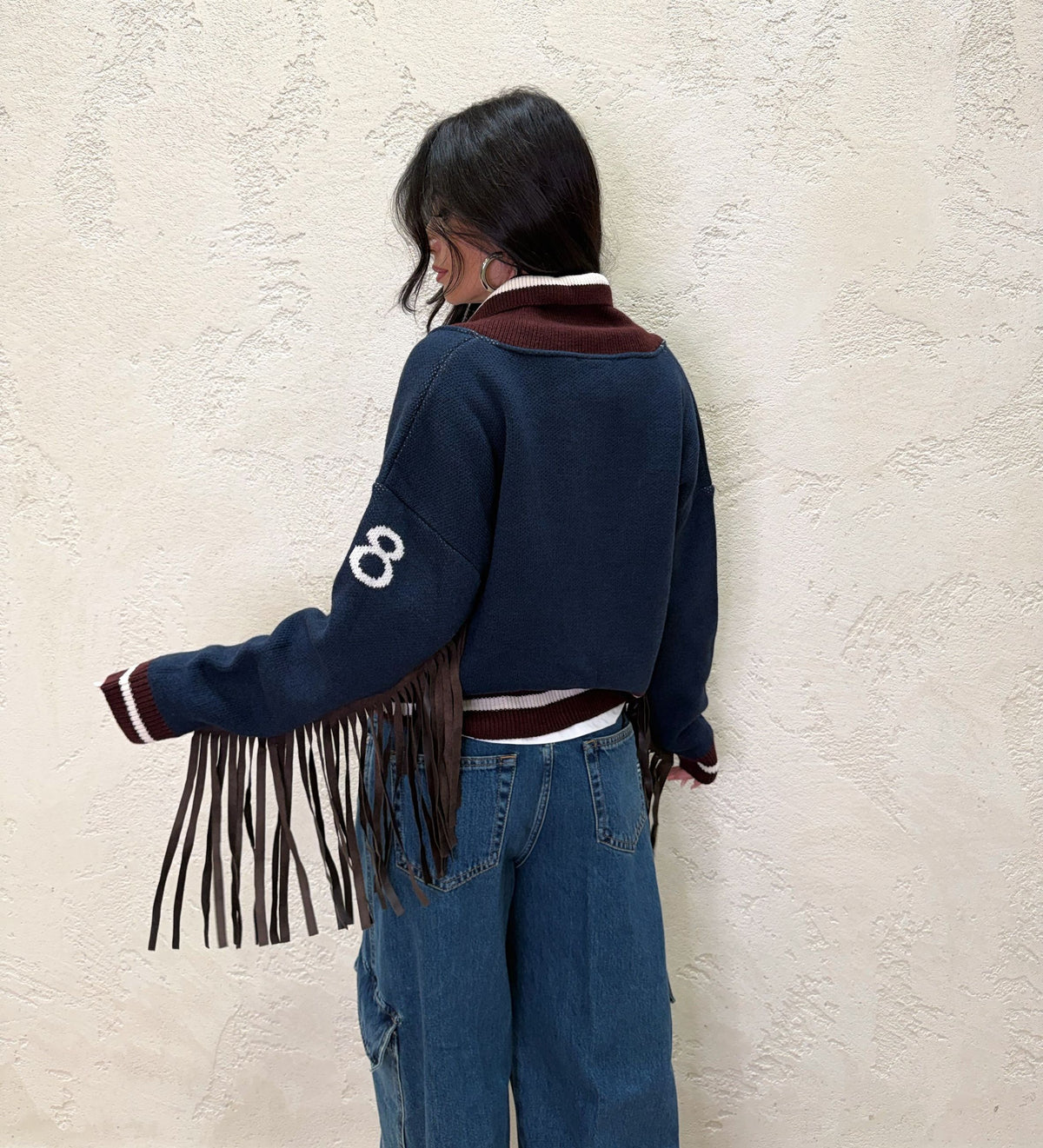 Cardigan con frange in ecopelle