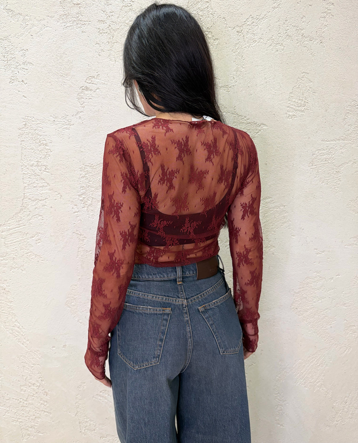 Maglia in pizzo con manicotti