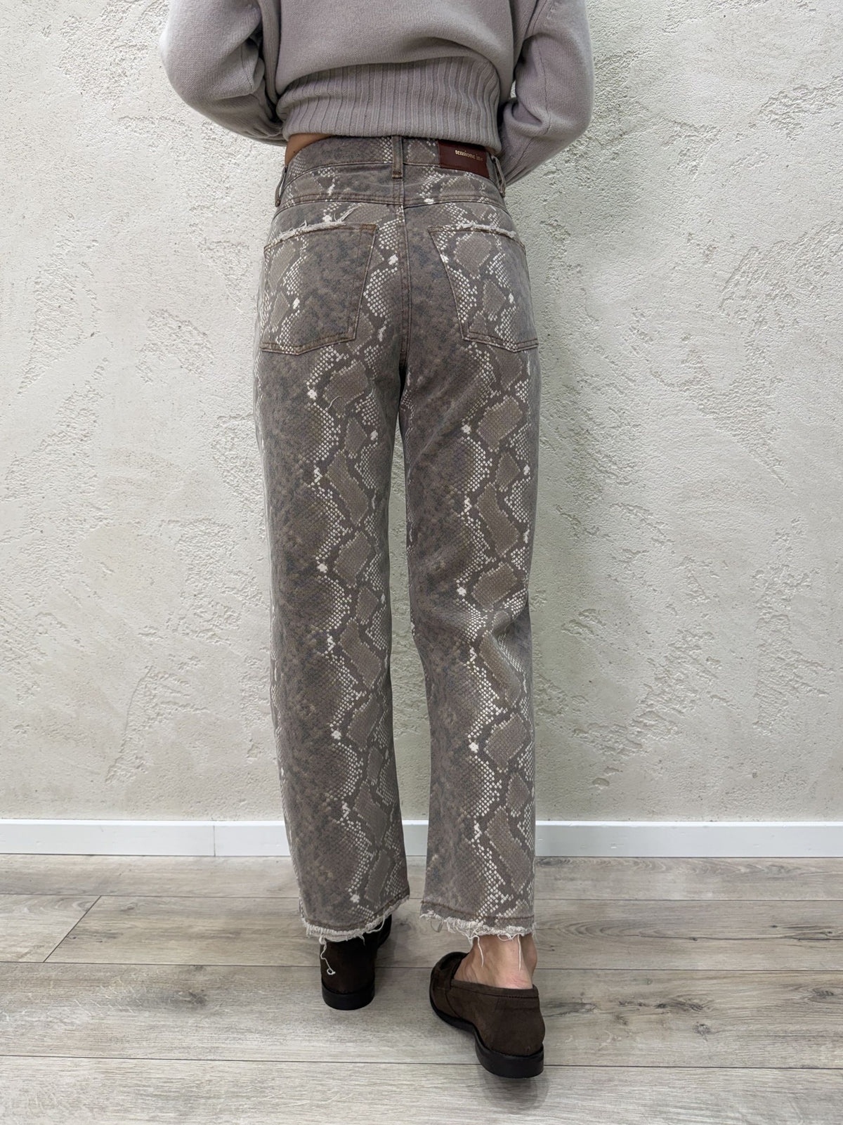 Jeans modello tom stampa pitonata